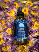Kitty Karma Studio: Lotus Bloom round bottle lying among petals