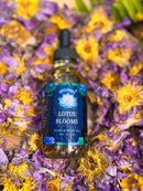 Kitty Karma Studio: Lotus Bloom round bottle among flowers