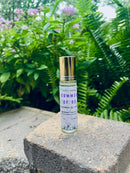 Kitty Karma Studio: Summer of 85 perfume roller on garden ledge