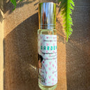 Kitty Karma Studio: Gardenia perfume roller on a sunlit wooden board