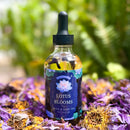 Kitty Karma Studio: Lotus Bloom oil in round dropper bottle outdoors
