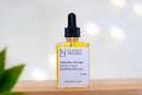 Elodie's Naturals: Golden face oil serum in clear dropper bottle